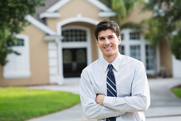Man standing in front of house