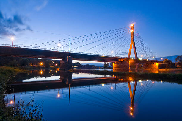 istock Illuminated modern river bridge with pilon, Niederwartha, near Dresden, Germany 187307863