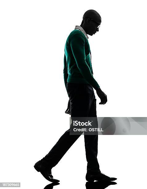 African Black Man Walking Looking Down Sad Silhouette Stock Photo - Download Image Now