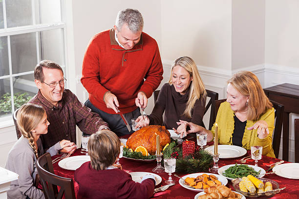 istock Multi-generation family enjoying holiday turkey dinner 187309668