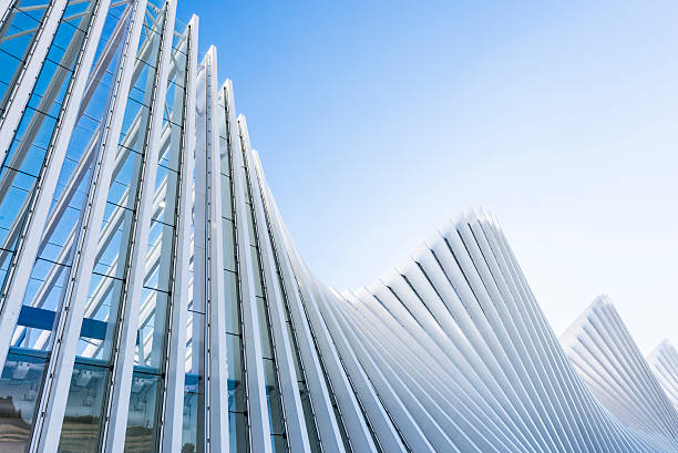 Abstract White Architecture Building on Clear Blue Sky Architectural exterior white building train station structure in Italy. architecture and buildings stock pictures, royalty-free photos & images