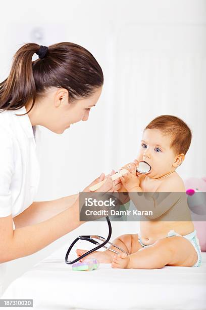 Baby At Pediatrician Office Stock Photo - Download Image Now - 30-34 Years, 30-39 Years, 6-11 Months