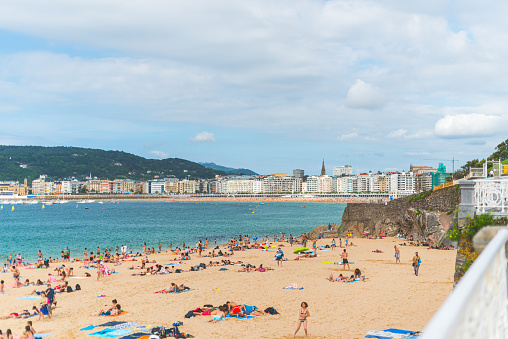 San Sebastian, Spain - July 26 2016: Ondarreta Beach with La Concha beach and the city centre in the background.