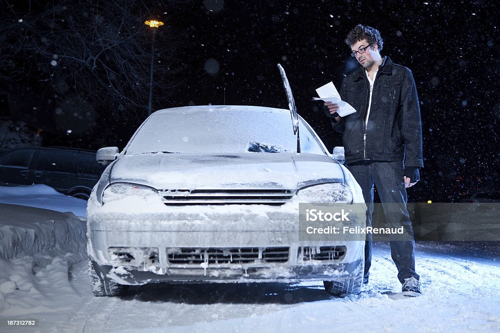 Man upset after getting a parking ticket Man upset after getting a night parking ticket during the winter Winter Stock Photo