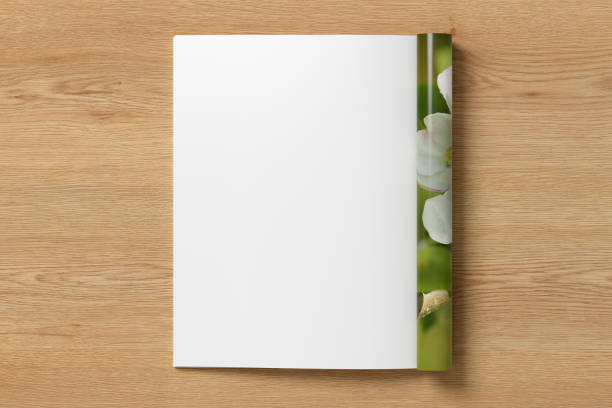 istock Magazine left-hand page mockup on wooden background 1873153585