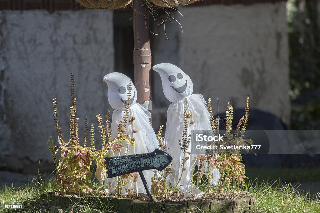 Toy ghosts. Pair of toy ghosts in the yard. Couple - Relationship Stock Photo