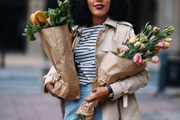 istock Unrecognizable Shopper with Groceries and Flowers 1873162948