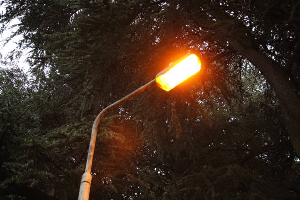Old street lamp fitted with a Low-pressure sodium bulb