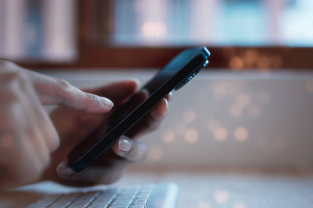 istock Social media marketing concept. businessman hand using smartphone typing, chatting conversation in chat box icons pop up in modern office 1873194070