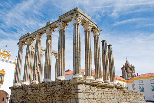 The Roman Temple of Evora ( a UNESCO World Heritage Site) was built in the first century CE.  It was built as a tribute to Emperor Augustus.  It was destroyed in the 5th century by invading Germanic peoples.  The Tower of Santa Maria Cathedral is visible in the background.