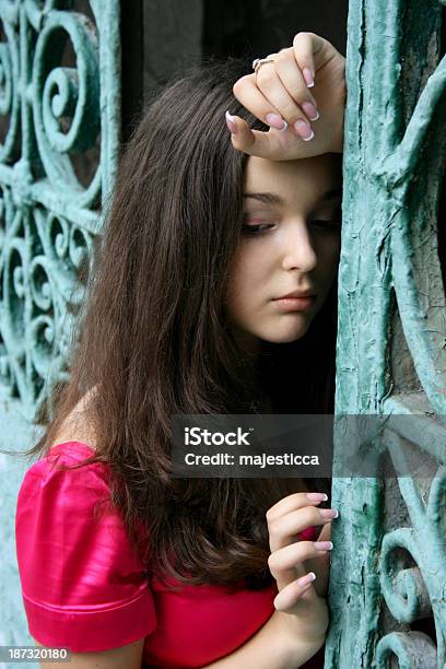 Young Caucasian Woman Near The Gates Stock Photo - Download Image Now - Adult, Adults Only, Affectionate