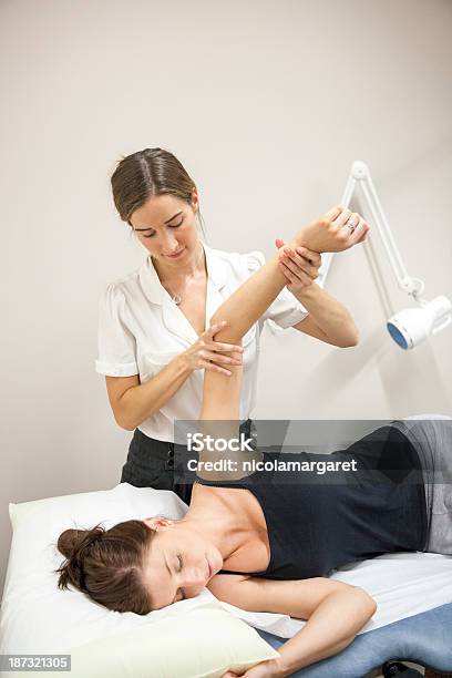 Physical Therapist Series Shoulderarm Mobility Stock Photo - Download Image Now - 25-29 Years, Adult, Adults Only