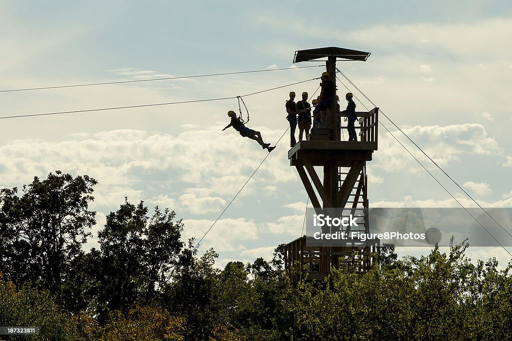 Zipline Tower Zipper stepping off Tower on a  Zipline Canopy Tour Zip Line Stock Photo