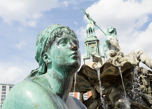 Neptune fountain in Berlin. It located in the center of Berlin between the Marienkirche church and the Red Town Hall.
