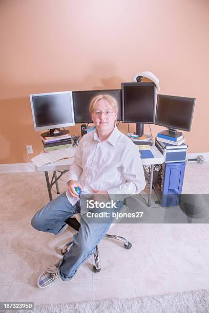 Young Man With Multiple Monitor Computer Setup Stock Photo - Download Image Now - Adult, Adults Only, Business