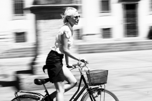 Young Woman Cycling,Milan,Italy.