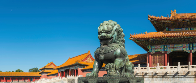 Bronze Imperial Lion guarding the marble steps to the Gate of Supreme Harmony in the Forbidden City, the UNESCO World Heritage Site in the heart of historic Beijing, China's vibrant capital city. ProPhoto RGB profile for maximum color fidelity and gamut.
