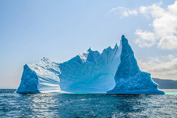 Iceberg, Newfoundland, Trinity Bay, Canada An iceberg in Trinity Bay, near St John, Newfoundland, off the eastern coast of Canada. newfoundland and labrador photos stock pictures, royalty-free photos & images