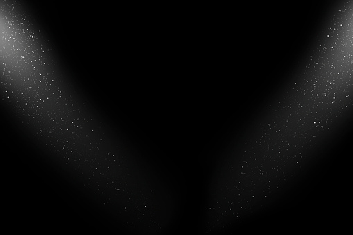 Two spot tilted lights from the top corners blinking over black background.