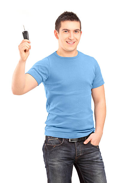 istock Young smiling guy holding car key 187325953