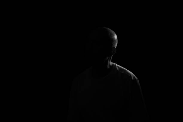istock Low light portrait of bearded, bald man. 1873260003