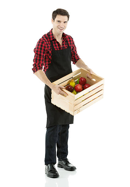 istock Man carrying a crate of fruits 187326103