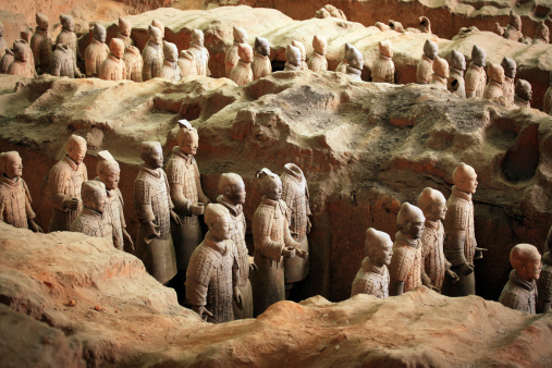 (The Terra Cotta Warriors and Horses are the most significant archeological excavations of the 20th century. Work is ongoing at this site, which is around 1.5 kilometers east of Emperor Qin Shi Huang's Mausoleum, Lintong County, Shaanxi province. It is a sight not to be missed by any visitor to China. The museum covers an area of 16,300 square meters, divided into three sections: No. 1 Pit, No. 2 Pit, and No. 3 Pit respectively. They were tagged in the order of their discoveries. No. 1 Pit is the largest, first opened to the public on China's National Day, 1979. There are columns of soldiers at the front, followed by war chariots at the back. No. 2 Pit, found in 1976, is 20 meters northeast of No. 1 Pit. It contained over a thousand warriors and 90 chariots of wood. It was unveiled to the public in 1994.Archeologists came upon No. 3 Pit also in 1976, 25 meters northwest of No. 1 Pit. It looked like to be the command center of the armed forces. It went on display in 1989, with 68 warriors, a war chariot and four horses. Altogether over 7,000 pottery soldiers, horses, chariots, and even weapons have been unearthed from these pits. Most of them have been restored to their former grandeur. The Terracotta Warriors and Horses is a sensational archeological find of all times. It has put Xian on the map for tourists. It was listed by UNESCO in 1987 as one of the world cultural heritages.)