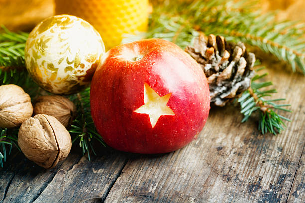 istock christmas apple on wood 187326637