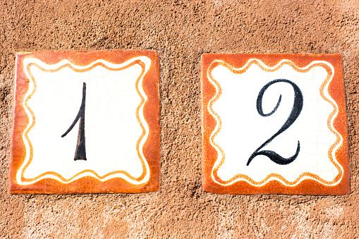 Ceramic Number 12 Street Address Tiles; Brown Stucco. Shot in Santa Fe, NM.