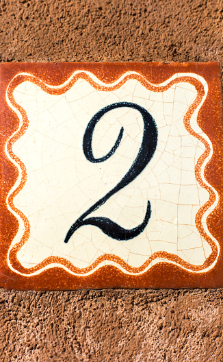 Ceramic Number 2 Street Address Tiles; Brown Stucco. Shot in Santa Fe, NM.