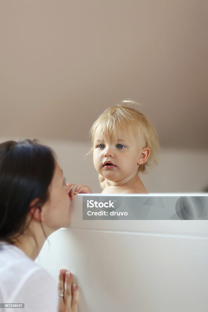 Nap Time Mother putting her daughter to sleep 30-39 Years Stock Photo