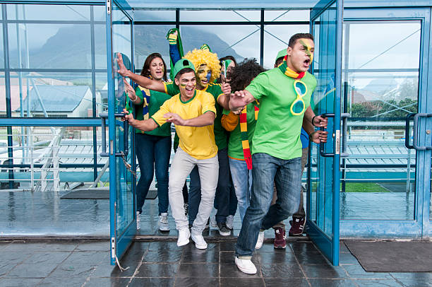 istock Excited soccer fans cheering 187328519