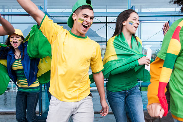 istock Excited soccer fans cheering 187328520