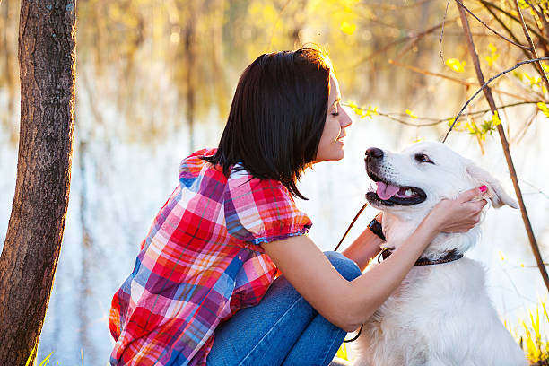istock young woman with a dog 187329123