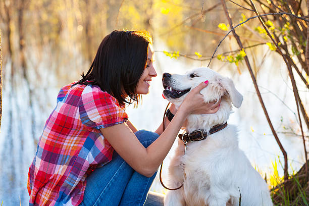 istock young woman with a dog 187329162