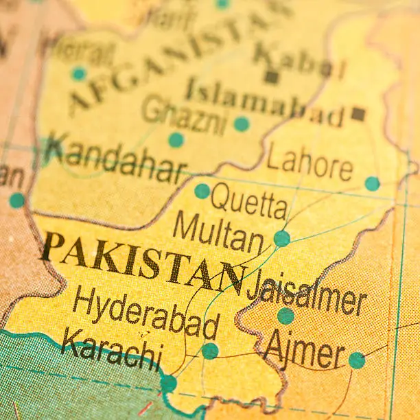 Studying Geography - Pakistan on retro globe.