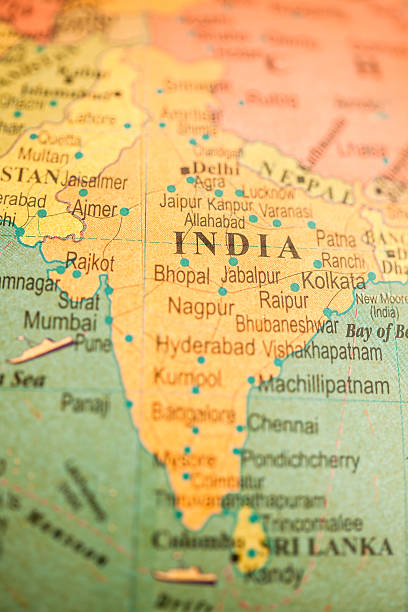 Studying Geography - India on retro globe.