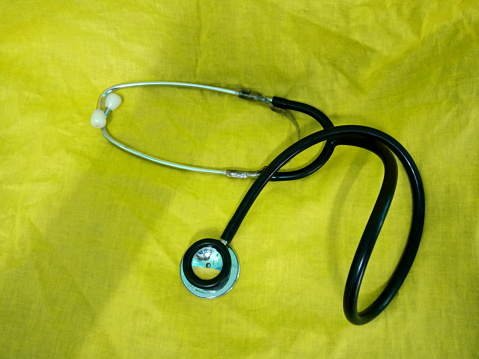 Stethoscope on a yellow  background. Medical equipment. close up. photo taken in malaysia