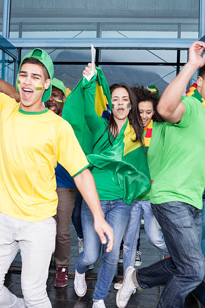 istock Excited soccer fans cheering 187329766