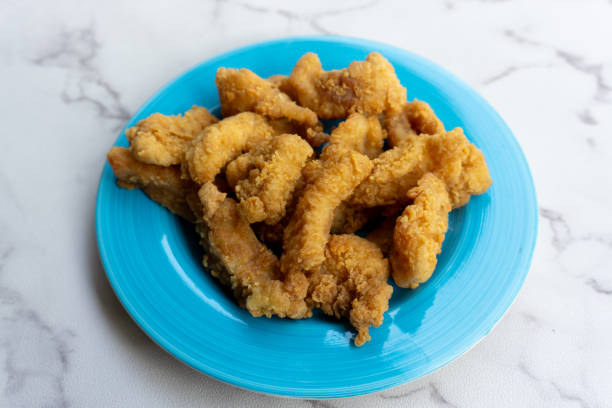 istock Delicious crispy fried chicken breast strips 1873299915
