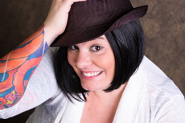 istock Young tattooed woman with silly smile. 187330001