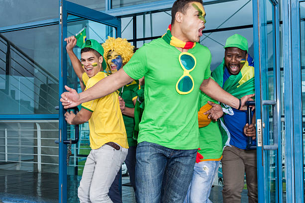 istock Excited soccer fans cheering 187330080