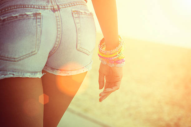 Rear view of sexy woman in jeans, closeup on buttocks stock photo