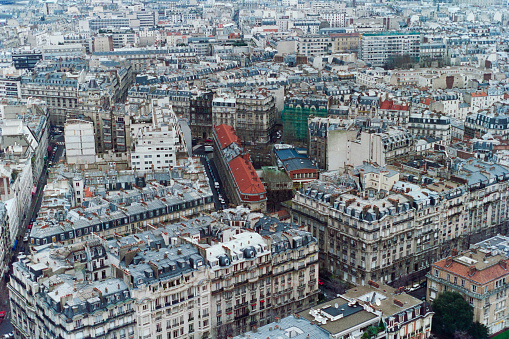 Grainy archival film photograph of historic buildings in Paris France. Photo taken December 1990.