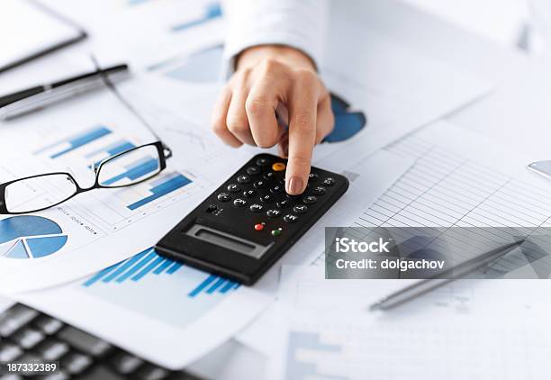 Woman Hand With Calculator And Papers Stock Photo - Download Image Now - Adult, Analyzing, Banking