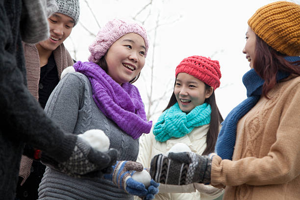 istock Friends Playing with Snowballs 187332587