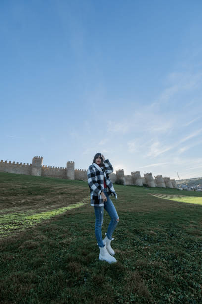 istock Caucasian tourist explores Avila in winter. 1873344418