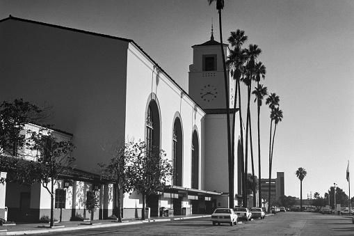 Grainy archival film black and white view of Union Station in downtown Los Angeles, California.  Shot in 1984.
