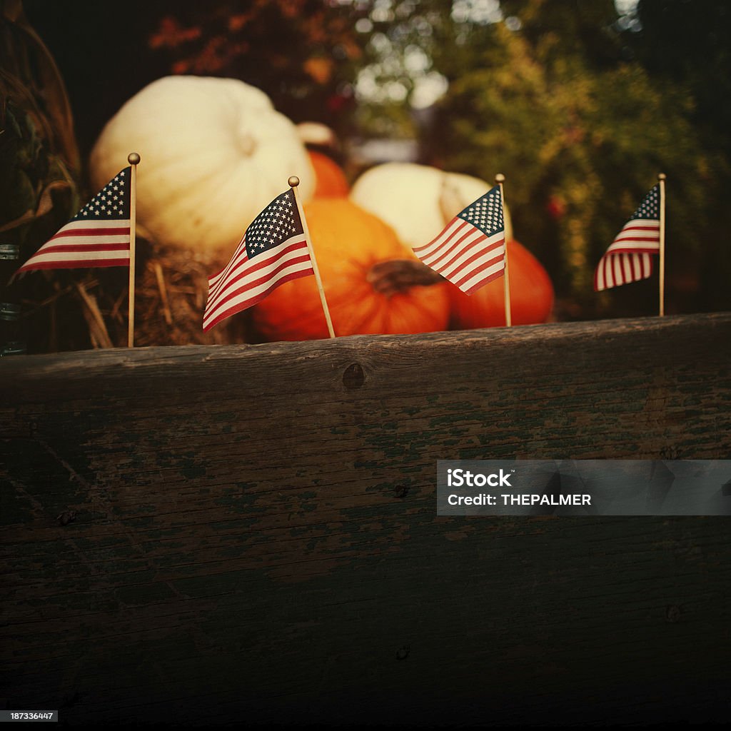 american flags small american flags on a wooden crate with pumpkins American Flag Stock Photo