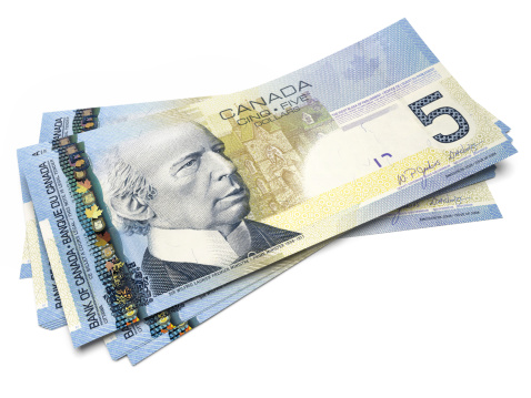 3D render of  bills of Five Canadian Dollars all in sharp focus.